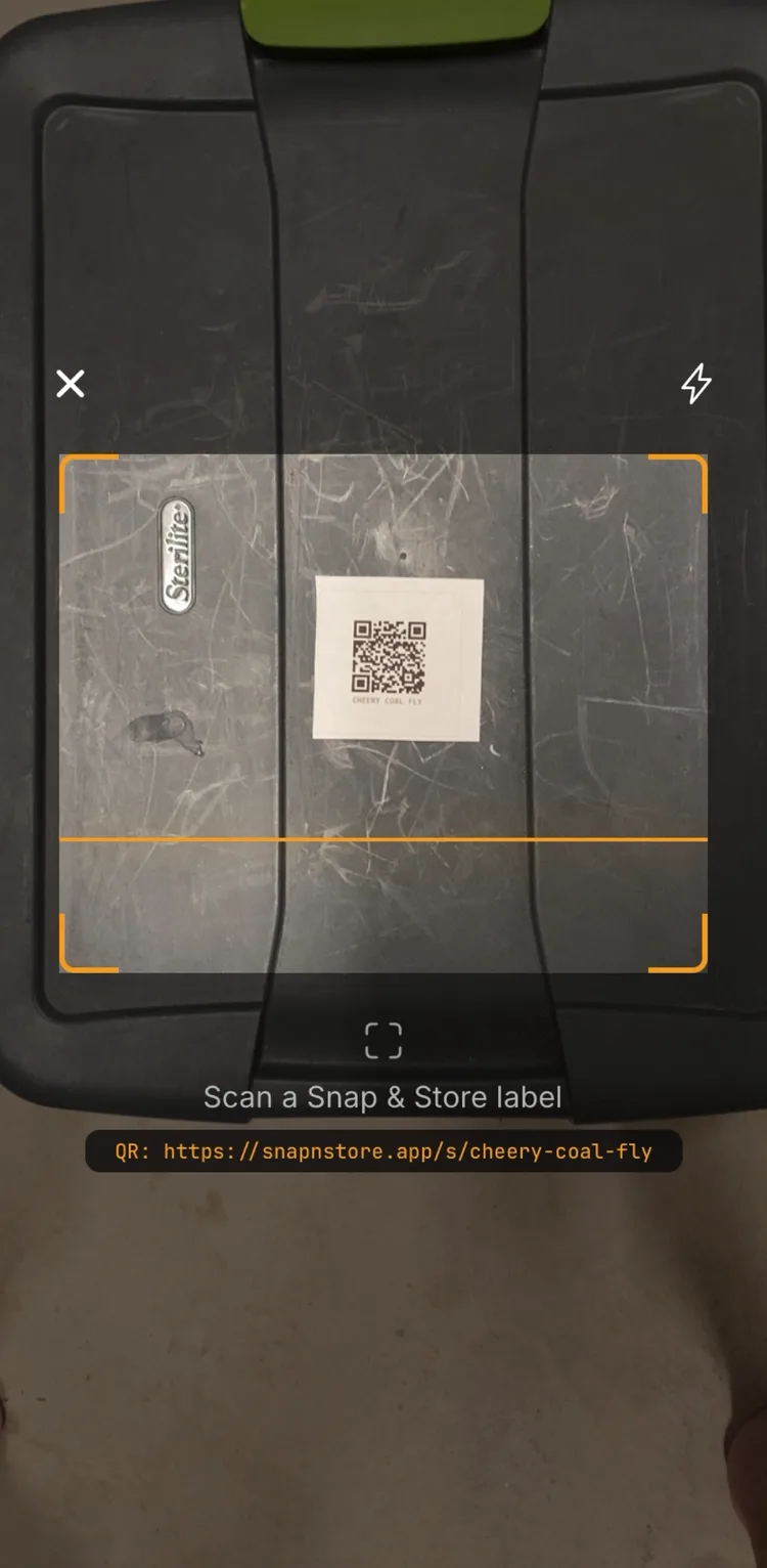 Scanning a Snap & Store QR label on a storage tote with the in-app scanner